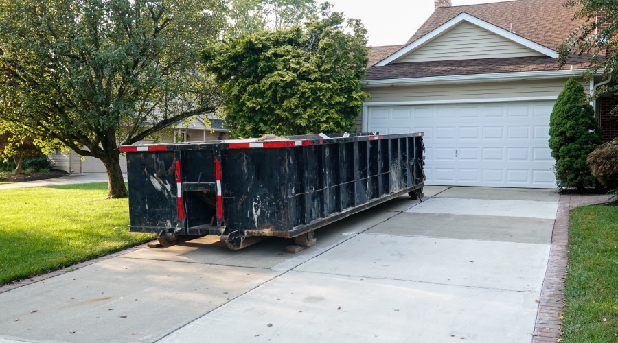 Roll-off dumpster rental in front of home