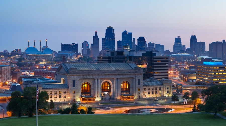 the evening skyline of kansas city, with union station in the foreground