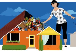 a giant woman removes junk through the roof of her house